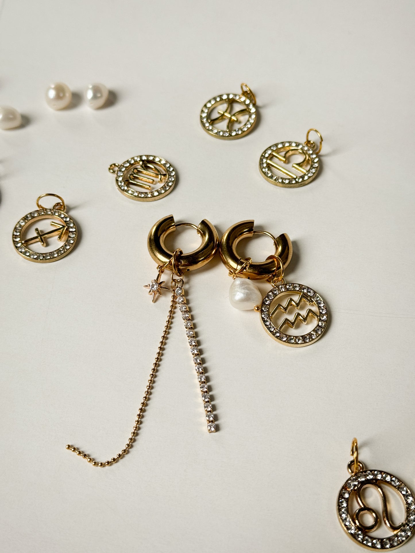 Zodiac earrings with a pearl