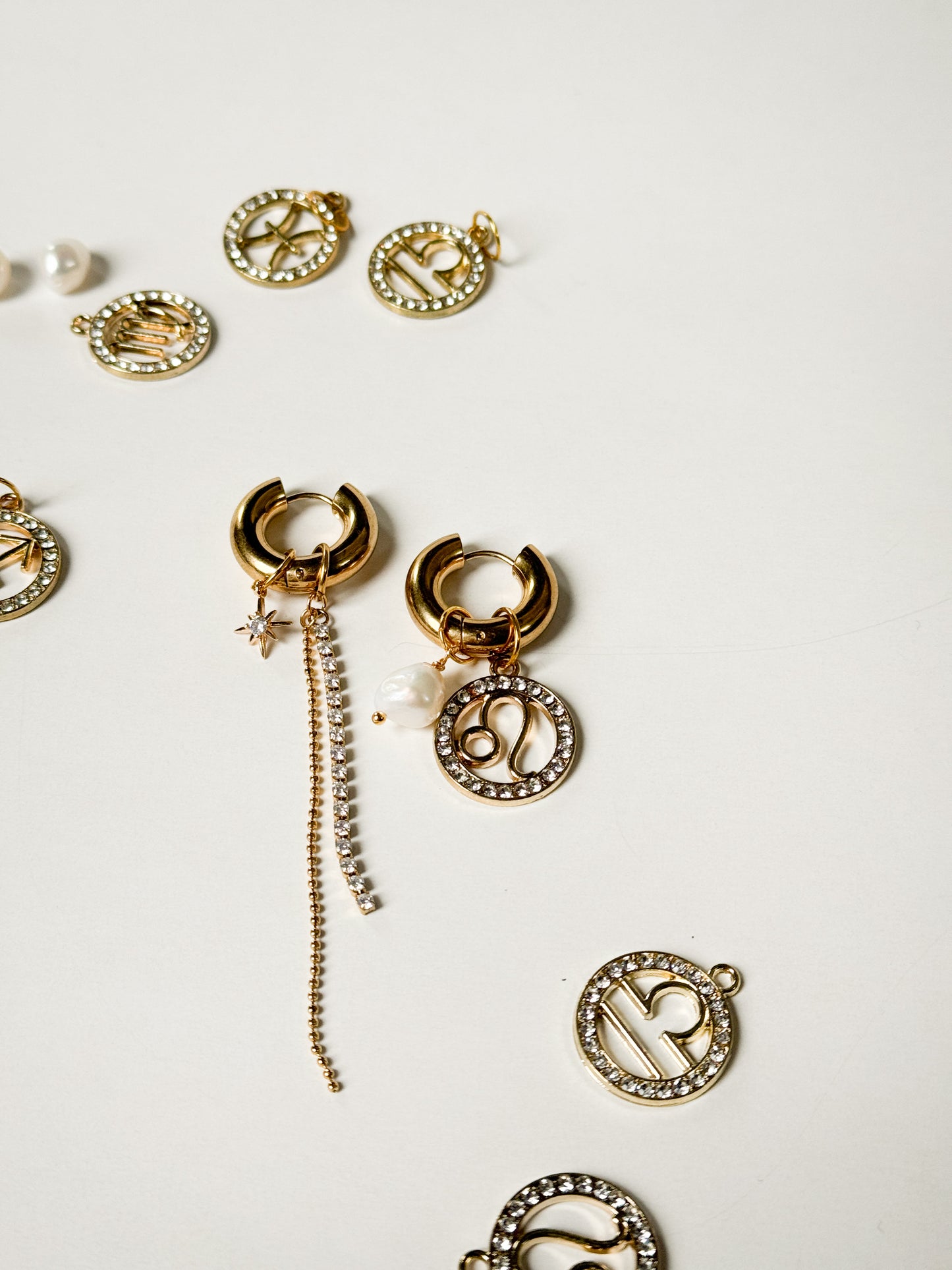 Zodiac earrings with a pearl