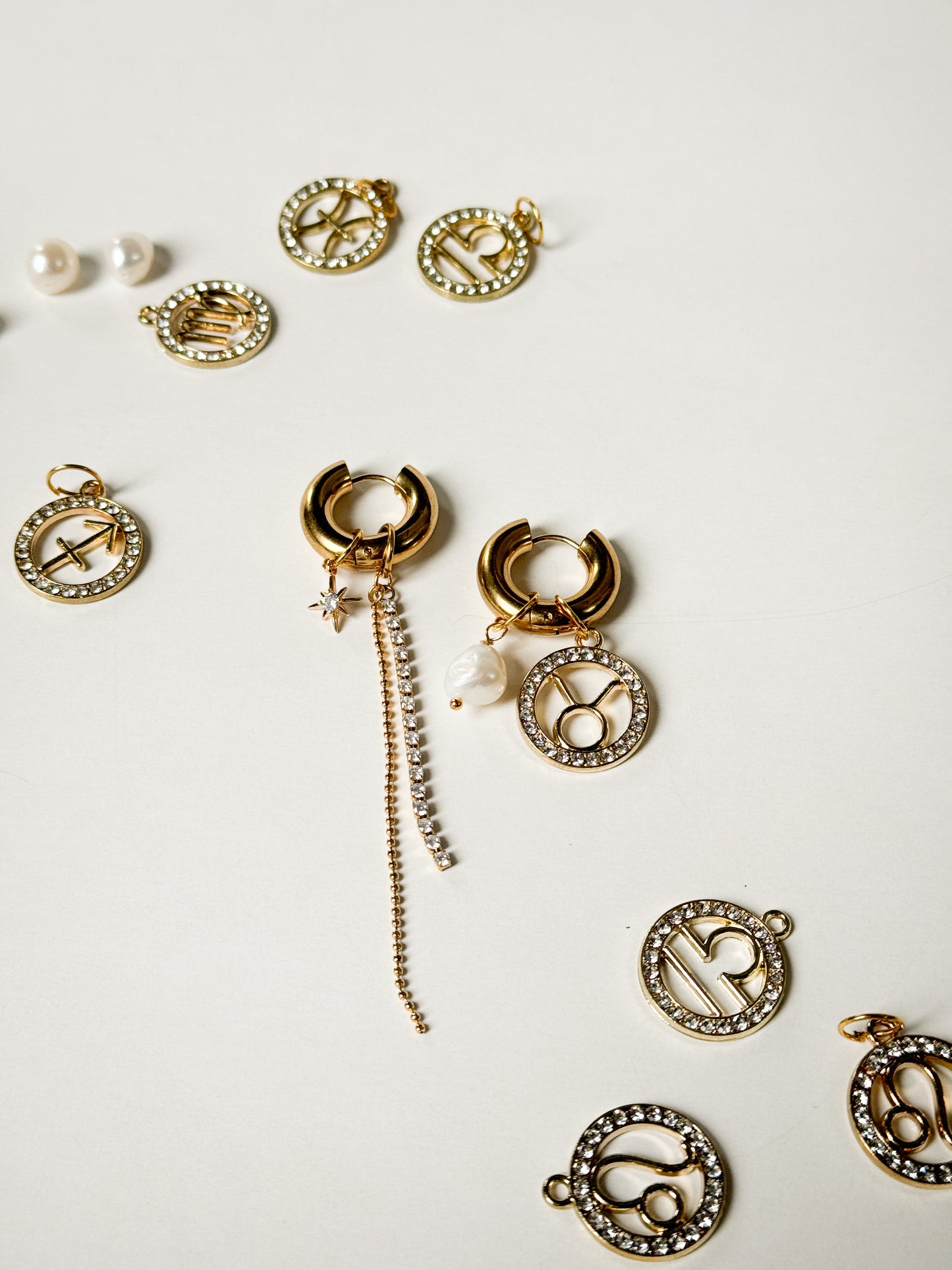 Zodiac earrings with a pearl