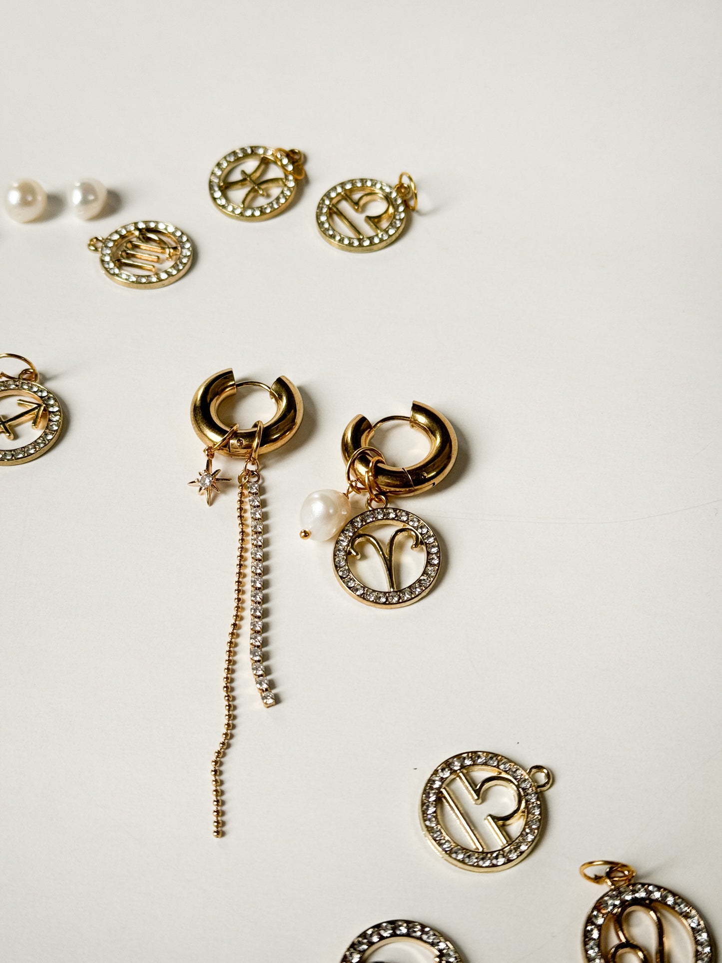 Zodiac earrings with a pearl