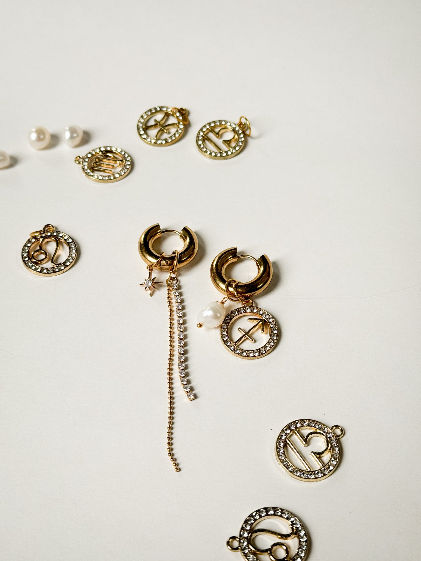 Zodiac earrings with a pearl